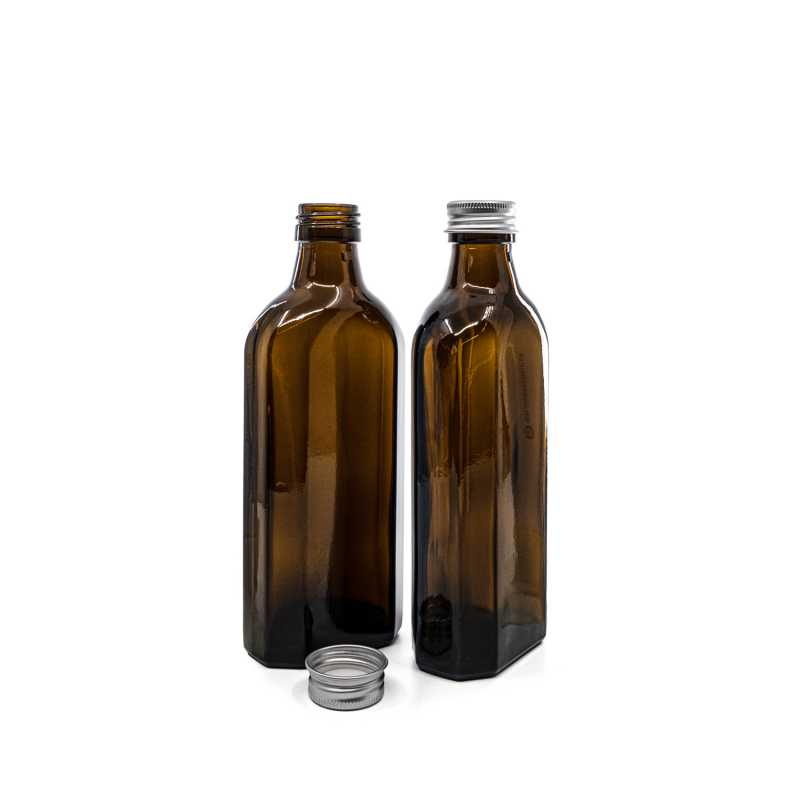 Theglass bottle is made of thick, dark brown glass with avolume of 250 ml. It is used for storing liquids, which thanks to its colour it effectively protects fr